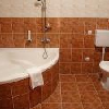 Bathroom with corner bath in Canada Hotel Budapest - cheap accomodation close to the M5 highway