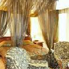 Elegant and romantic room with canopy bed of Duna Relax Event Wellness Hotel in Rackeve